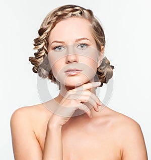 Portrait of young woman with braid hairdo