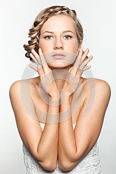 Portrait of young woman with braid hairdo