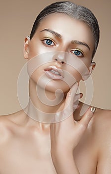 Portrait of Young Woman with Bronzed Skin