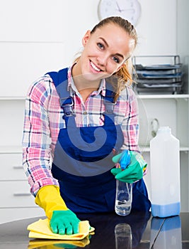 Portrait of young woman cleaning photo