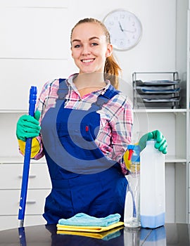 portrait of young woman cleaning photo