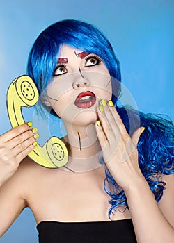 Portrait of young woman in comic pop art make-up style. Female