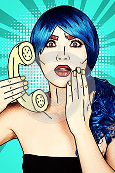 Portrait of young woman in comic pop art make-up style. Female in blue wig on blue background calls by phone