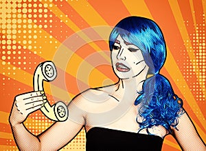 Portrait of young woman in comic pop art make-up style. Female in blue wig calls by phone