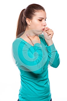 Portrait of an young woman coughing with fist