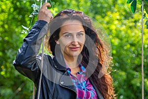 Portrait of a young woman with dark long hair.