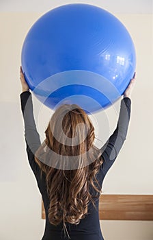 Portrait of young woman doing physical therapy exercises