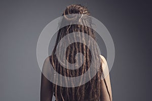 Portrait of young woman,  dreadlocks and long hair
