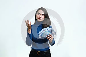 Portrait of a young woman dressed in a blue with tenge in hand