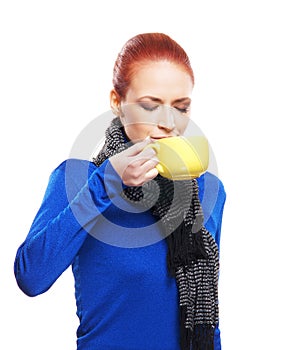 Portrait of a young woman drinking a cup of coffee