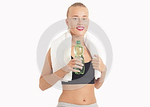 Portrait Of Young Woman Drinking Water After Jogging