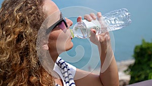 Portrait of Young Woman Drinking Water Outdoor