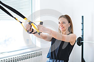 portrait of young woman exercising at the gym