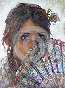 Portrait of a young woman and face covered by fan