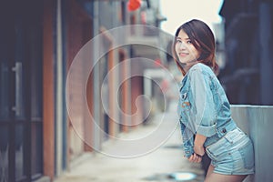 Portrait young woman fashion model lifestyle. Beautiful girl wearing denim jeans posing curve body.