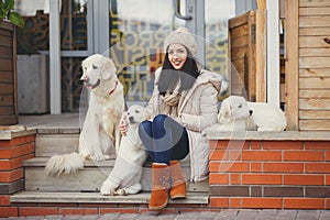 Portrait of the young woman with favourite dogs