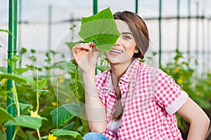 Portrait of young woman gardening