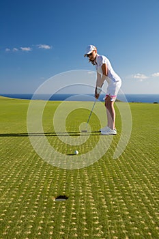Portrait of young woman golfer