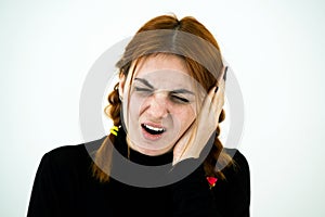 Portrait of a young woman having ear pain