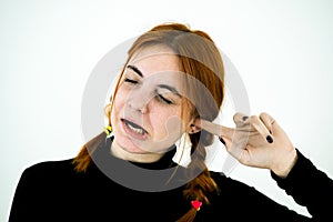 Portrait of a young woman having ear pain