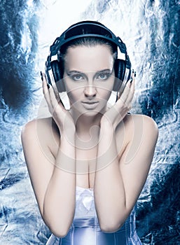 Portrait of a young woman in headphones and makeup