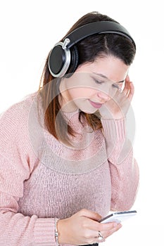 Portrait of a young woman with headphones and mobile smartphone cell