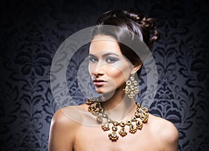 Portrait of a young woman in jewelry