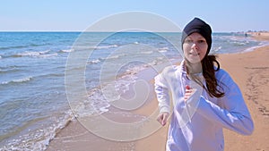 Portrait of young woman jogging at sea sand beach sport outdoor run training.