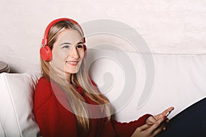 Portrait of young woman listening to music.