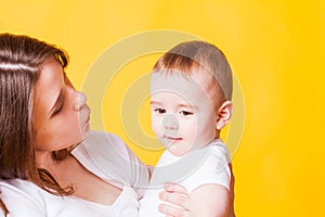 Portrait of young woman and a little baby