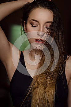 Portrait of young woman with long wet hair