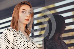 Portrait of young woman looking at camera