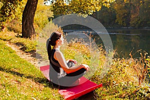 Portrait of young woman meditating in the sunlight