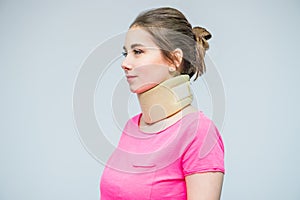 Portrait of young woman with a neck injury, osteochondrosis collar to prevent and physiotherapy. Pain treatment. Neurology, Osteop