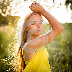 Portrait of young  woman  outdoor on a spring/summer sunny day