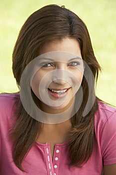 Portrait Of Young Woman In Park