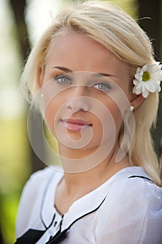 Portrait of young woman in park