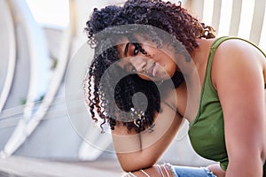 portrait of a young woman with a penetrating glance and a hand in her hair