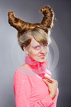 Portrait of young woman with pink plume