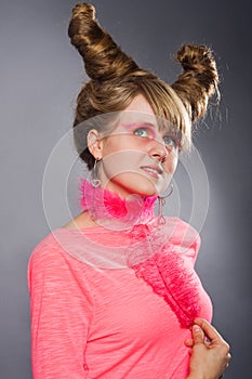 Portrait of young woman with pink plume