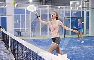 Portrait of a young woman playing padel