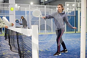 Portrait of a young woman playing padel