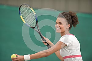 portrait young woman playing tennis