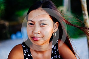 Portrait of a young woman with positive attitude smiling