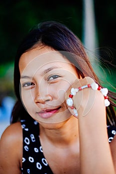 Portrait of a young woman with positive attitude smiling