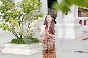 portrait young woman praying at Wat