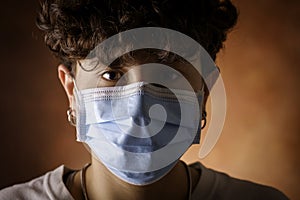 Portrait of young woman with protective mask