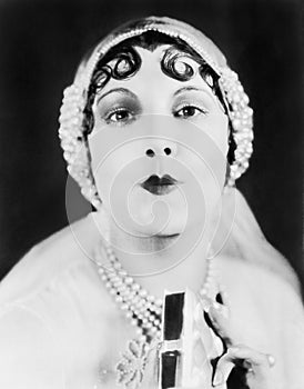 Portrait of a young woman puckering up