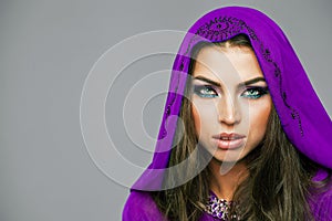 Portrait of the young woman in purple tunic Arabic