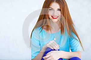 Portrait of a young woman with red hair